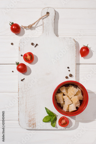 Photos top view of various italian food on white wooden cutting board