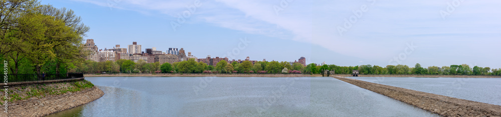 Central park reservoir with New York cityscape