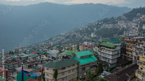 4K day to night Time lapse of the cloudy day in Gangtok city, capital of Sikkim state, Northern India. photo