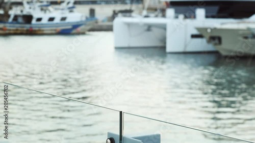 White boats and yachts and water flowing at sunset. photo