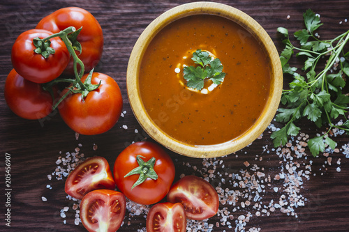 Tomato soup in a wooden bowl