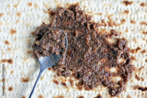 Date and walnut spread (Charoset) over a Matzo bread photo