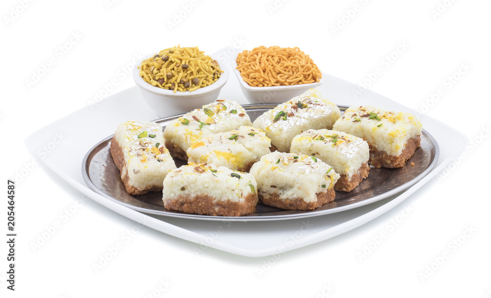 Indian Diwali Sweet Food Kalakand Also Know as Halwa or Mawa Kalakand is a Creamy Delicacy Made From Paneer or Cottage Cheese, The Dish Originated in Alwar, Rajasthan. Isolated on White Background Indian Diwali Sweet Food Kalakand Also Know as Halwa or Mawa Kalakand is a Creamy Delicacy Made From Paneer or Cottage Cheese, The Dish Originated in Alwar, Rajasthan. Isolated on White Background