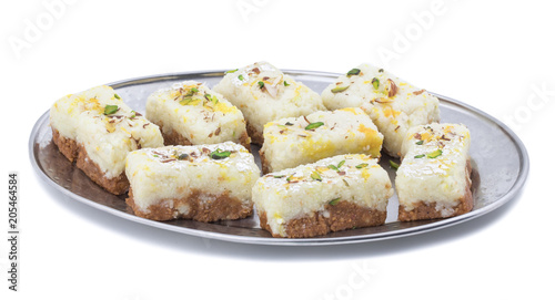 Indian Diwali Sweet Food Kalakand Also Know as Halwa or Mawa Kalakand is a Creamy Delicacy Made From Paneer or Cottage Cheese, The Dish Originated in Alwar, Rajasthan. Isolated on White Background