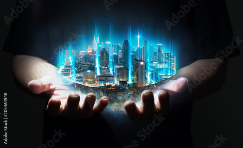 Unknown hand holding fantasy island floating in the air with network light came out from the ground , Smart city and wireless network connection concept .