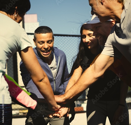 Konstfotografi Active group of friends stacking hands