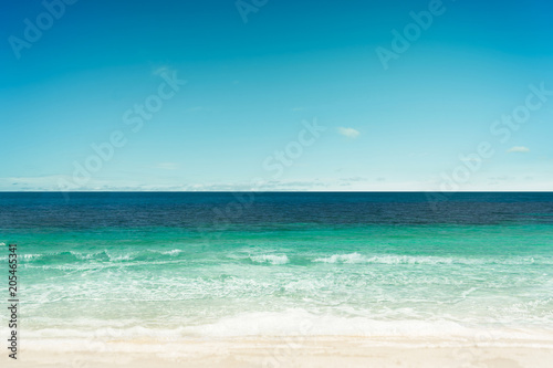 Tropical beach and sea with sunny sky . © jamesteohart