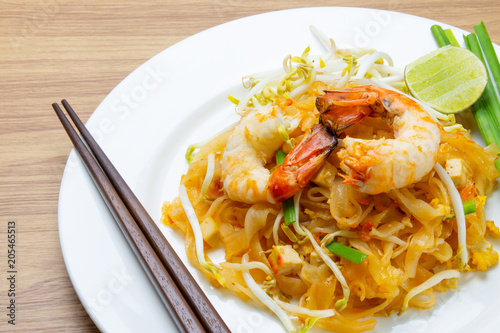 pad thai with shrimp on white dish 