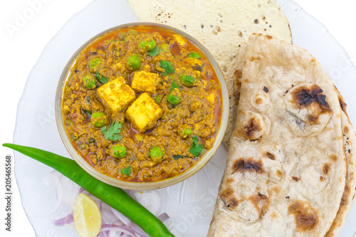 Indian Cuisine Mattar Paneer is a Vegetarian North Indian Dish Consisting of Peas And Paneer in a Tomato Based Sauce, Spiced with Garam Masala. It is often Served with Indian type of Tandoori Roti