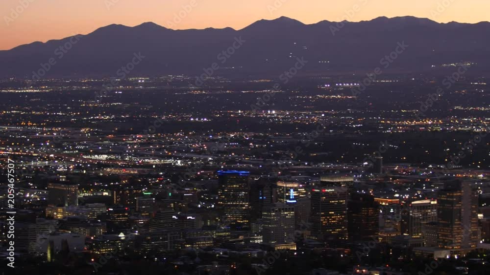 Lights shine in the Salt Lake City skyline at dusk. Lights shine in the Salt Lake City skyline at dusk.