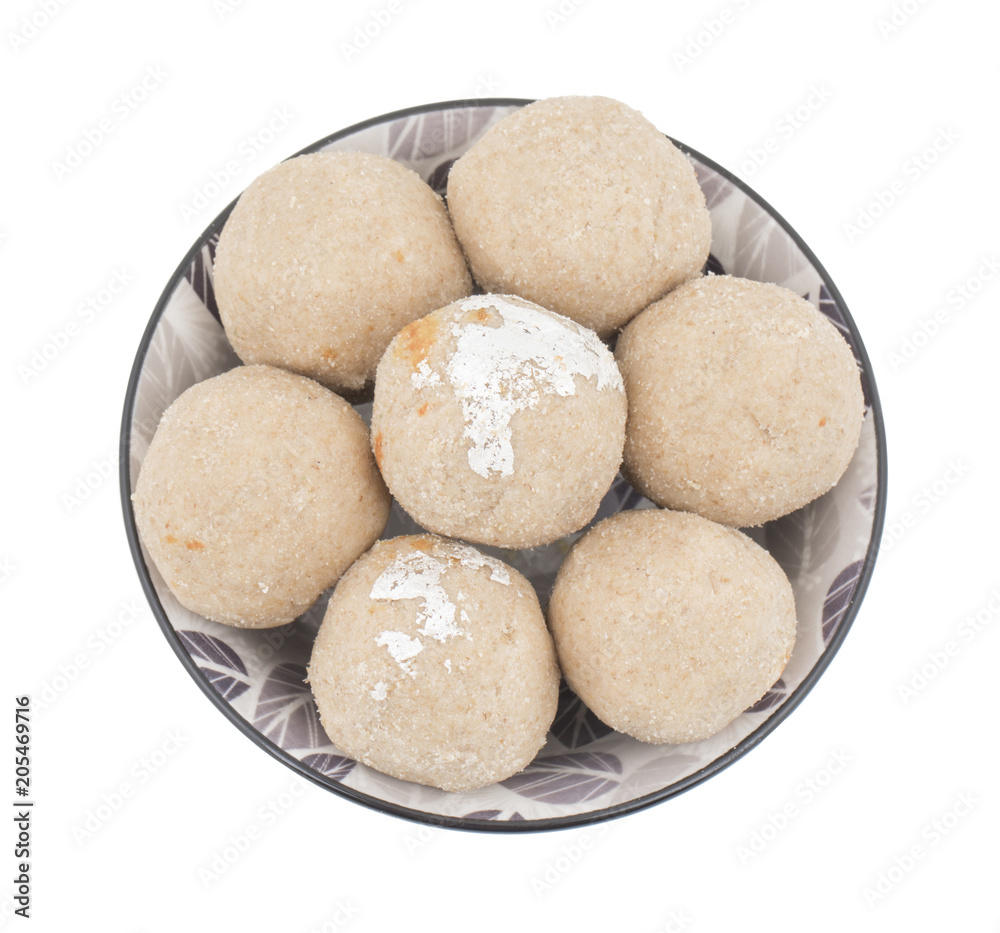 Gehu Ke Laddu Indian Traditional Sweet Food Also Know as Wheat Laddu, Laddoos, laddoo, ladoo, laddo Are Ball-Shaped Sweets Popular in The Indian Festivals. isolated on White Background Gehu Ke Laddu Indian Traditional Sweet Food Also Know as Wheat Laddu, Laddoos, laddoo, ladoo, laddo Are Ball-Shaped Sweets Popular in The Indian Festivals. isolated on White Background