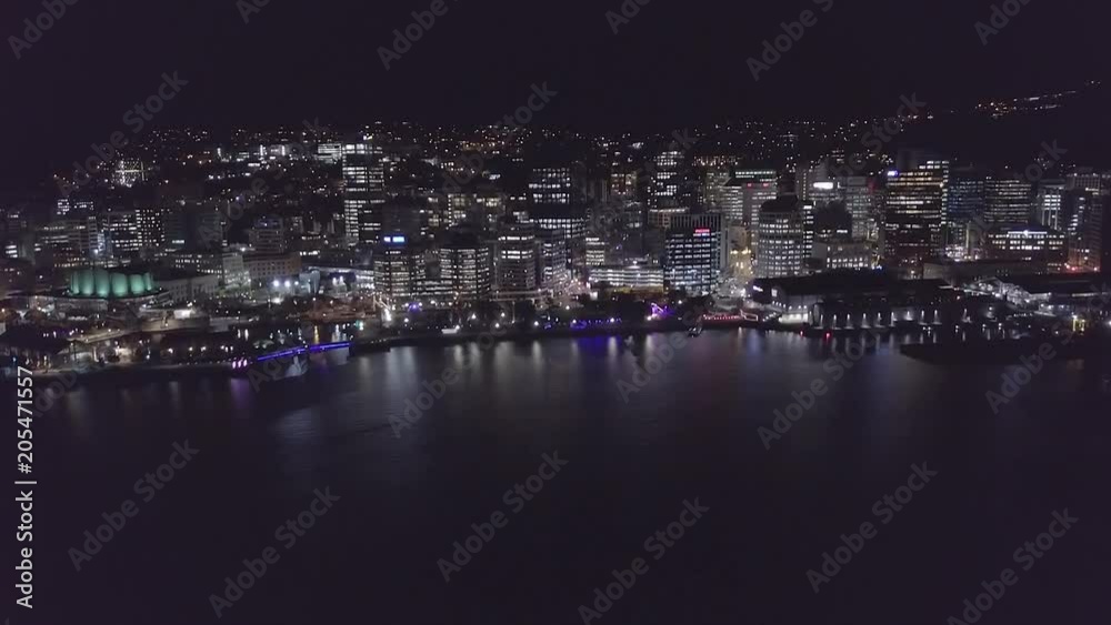 Aerial, Flying Into City At Night, Reflections Of City Lights On Harbor Aerial, Flying Into City At Night, Reflections Of City Lights On Harbor