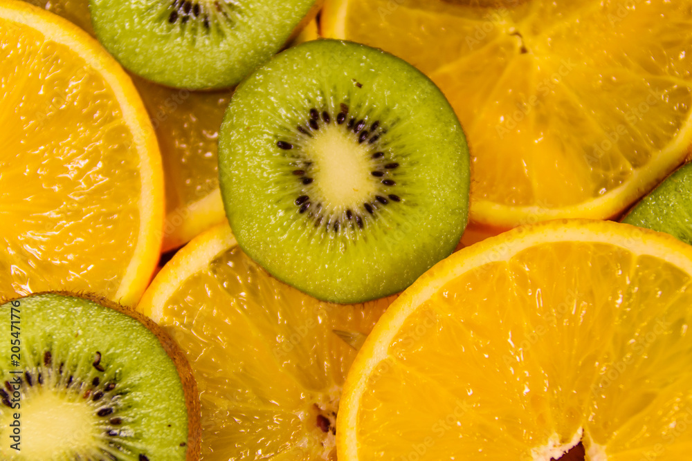 Fototapeta premium Background of the kiwi and orange fruits