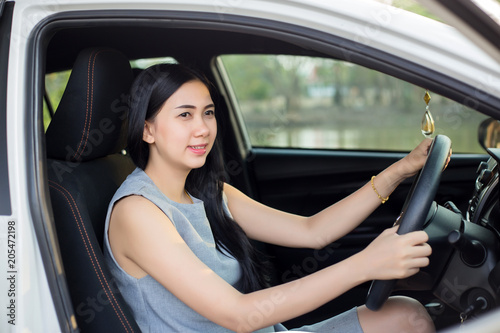 Pretty Asian women in a white car happy driving © aot
