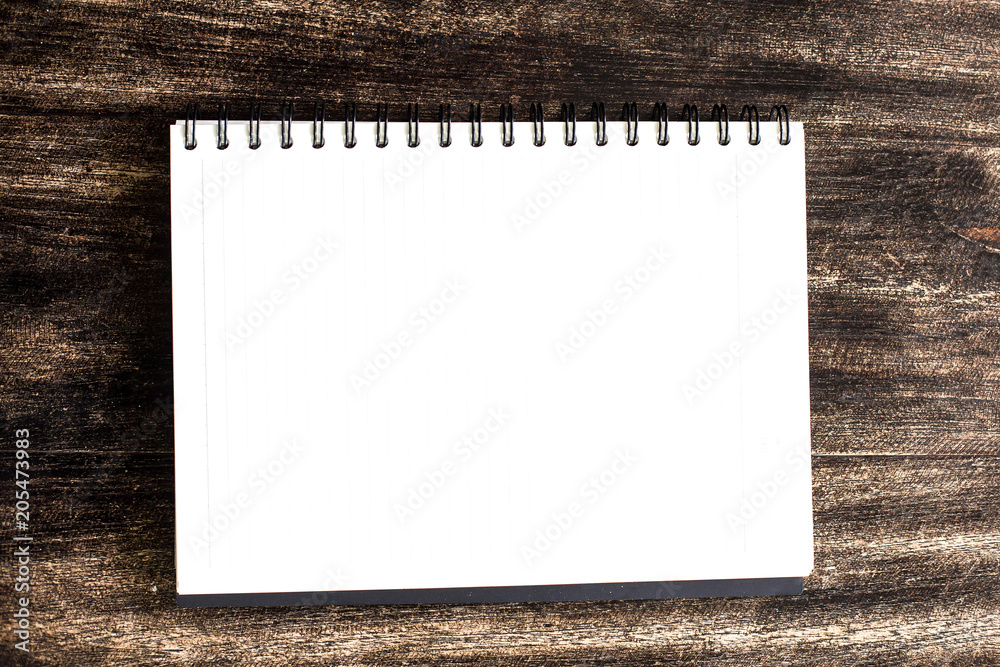 notebook on a wooden table notebook on a wooden table