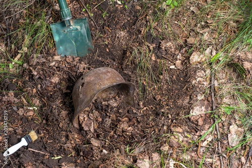 Excavations in the forest. The German helmet. Imitation. WW2 recovery. Russia.