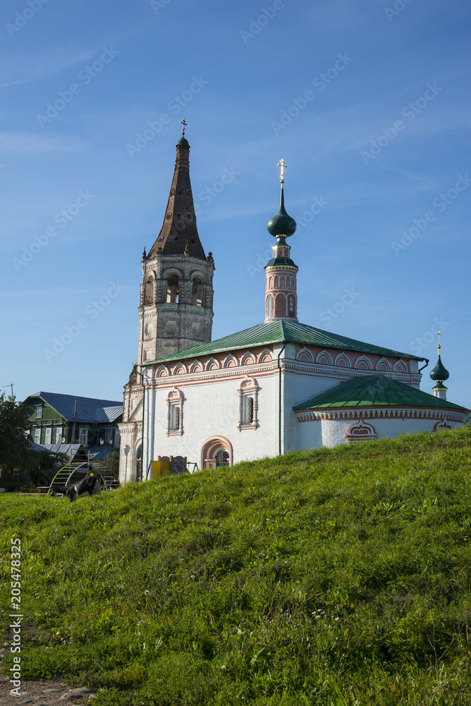 Bell tower and orthodox church in the Suzdal, Russia