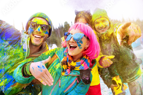 Happy friends at winter holi colors festival