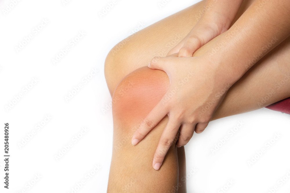 The girl, her knee pain By playing sports.She was massaging it To relieve pain
