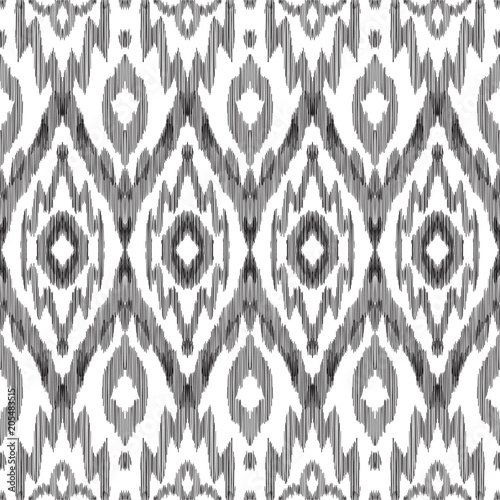 Tribal pattern. Seamless background. Scribble texture. Black and white graphic design. Creative vector illustration. Ethnic boho ornament. Impressive fashion print.