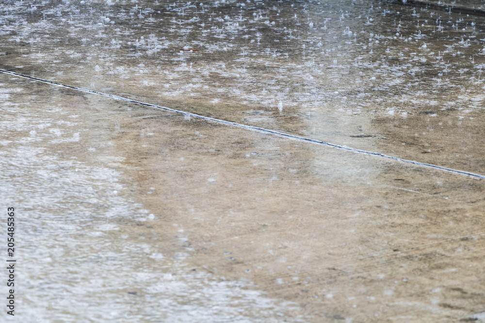 The Heavy rain drops on concrete floor The Heavy rain drops on concrete floor