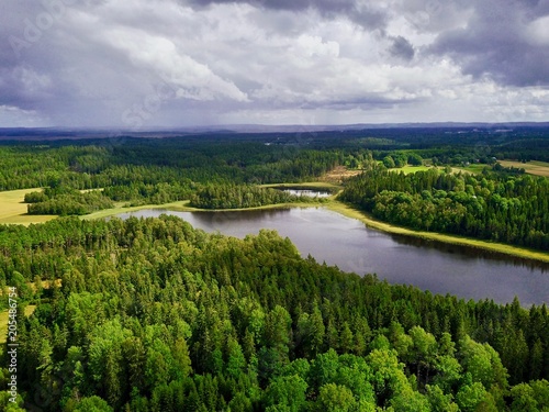 Aerial view over lake and wild forest in summer  Moasj  n lake in    Sweden