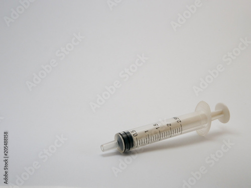 Plastic syringe, place for text, close-up