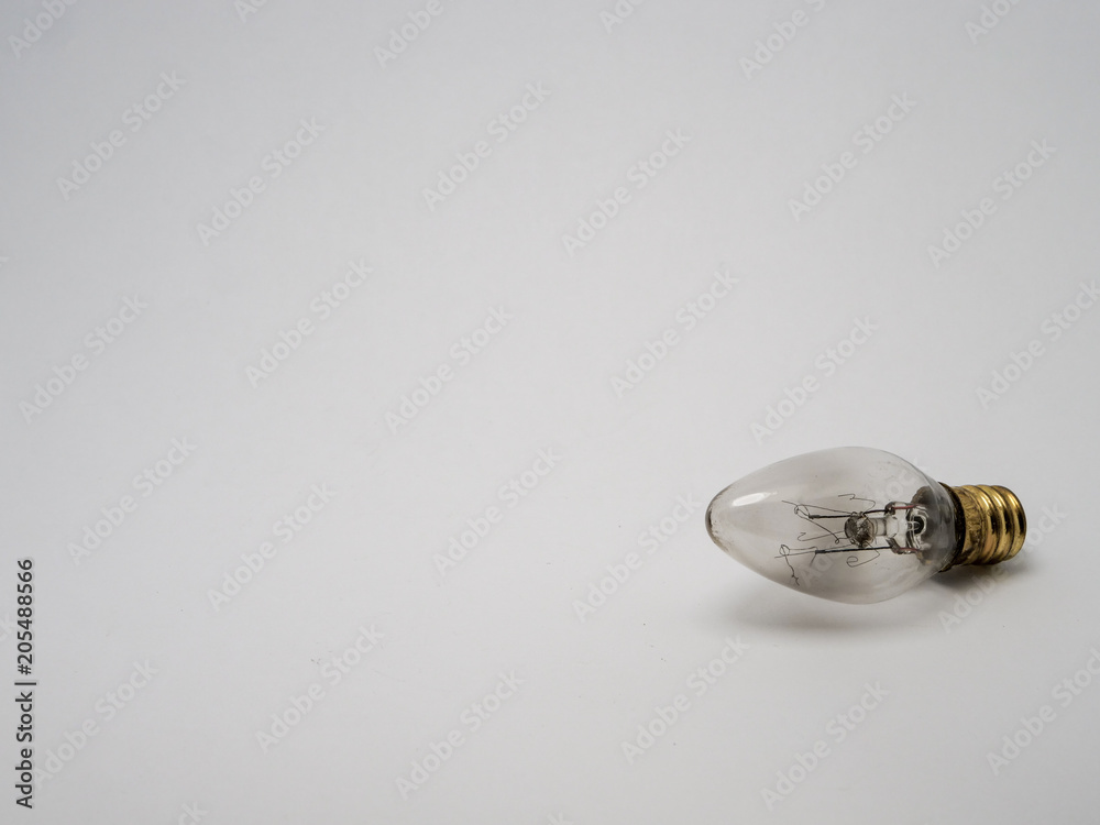 A light bulb on a white background, a place for text A light bulb on a white background, a place for text