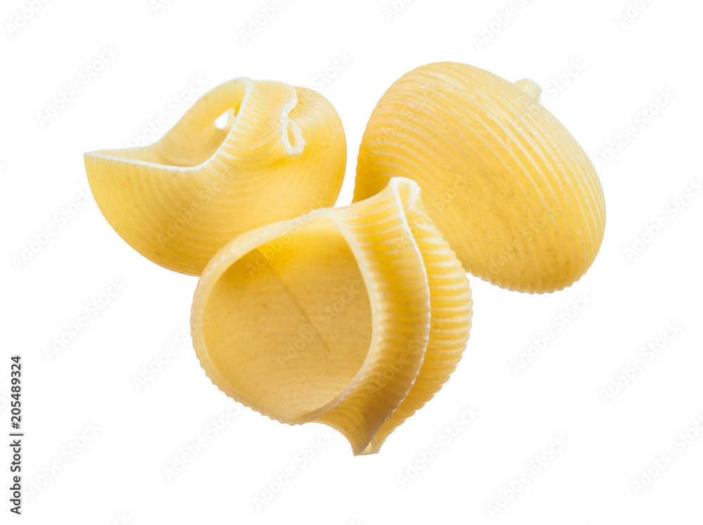 Wholegrain raw pasta shells isolated on white Wholegrain raw pasta shells isolated on white