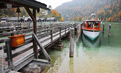 Wallpaper Mural Sightseeing boat parking by a wooden pier at beautiful lakeside in a misty foggy morning on Lake Konigssee ~ Beautiful  Autumn scenery of Koenigssee (King's lake) in Bavaria, Germany Torontodigital.ca