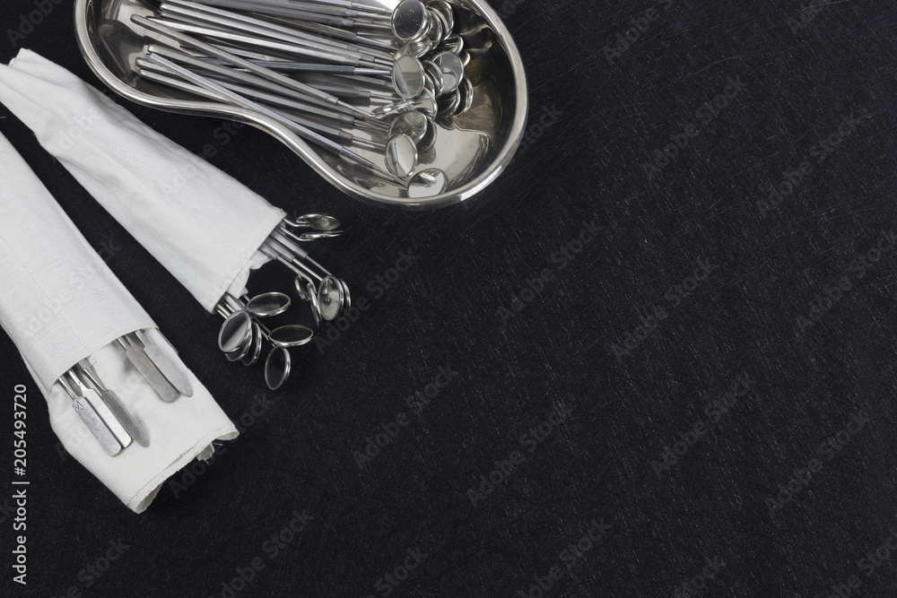 dental and endodontic instruments on black. Top view. dental and endodontic instruments on black. Top view.