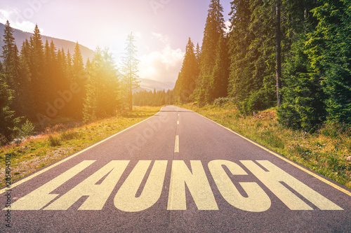 Launch word written on road in the mountains