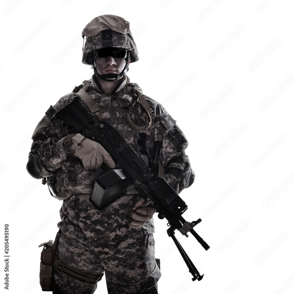 Low key studio portrait of US Armed Forces soldier in protective camouflage, helmet and tactical sunglasses holding light machine gun and looking in camera desaturated, isolated on white background Low key studio portrait of US Armed Forces soldier in protective camouflage, helmet and tactical sunglasses holding light machine gun and looking in camera desaturated, isolated on white background