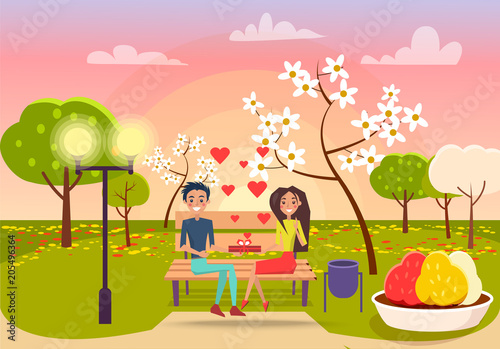 Young Male and Female Sits on Bench and Holds Gift