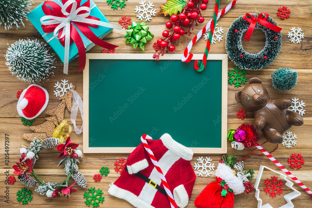 Flat lay of vintage Christmas ornaments decoration and blank green board on wooden table background, Christmas greeting festival celebration