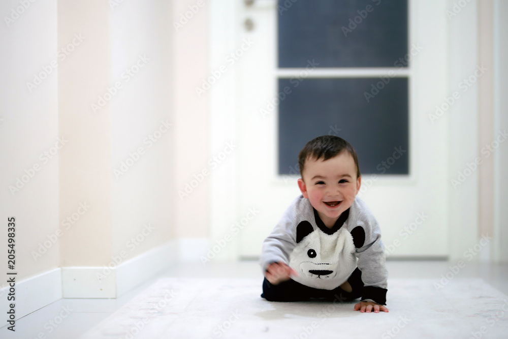 close up of funny baby boy crawling on carpet at home close up of funny baby boy crawling on carpet at home