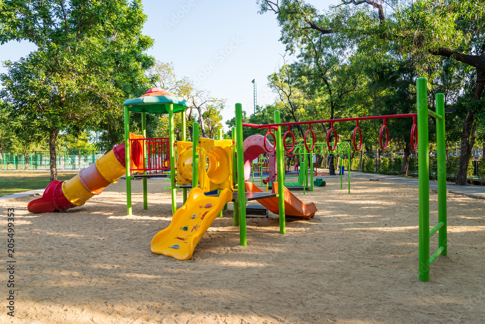 Outdoor children playground in green nature city park