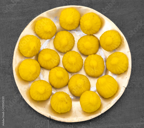 Indian Sweet Food Modak Also Know as Laddu, Khoya, khova Modak, Kozhakkatta, Modhaka, Kadubu, Modhakam, Kozhakkattai, Kudumu. Made up of Coconut And Jaggery, Rice Flour, Wheat with Khava photo