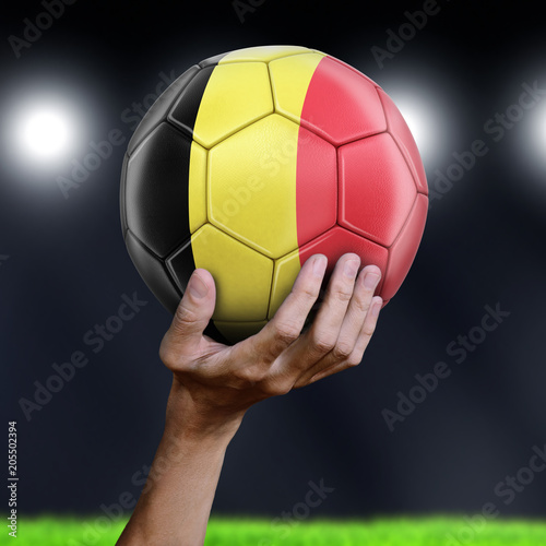 Man holding Soccer ball with Belgian flag
