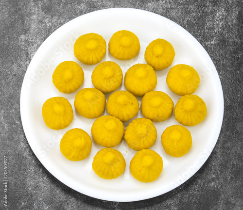 Indian Sweet Food Modak Also Know as Laddu, Khoya, khova Modak, Kozhakkatta, Modhaka, Kadubu, Modhakam, Kozhakkattai, Kudumu. Made up of Coconut And Jaggery, Rice Flour, Wheat with Khava photo