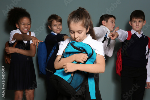 Children bullying their cla...