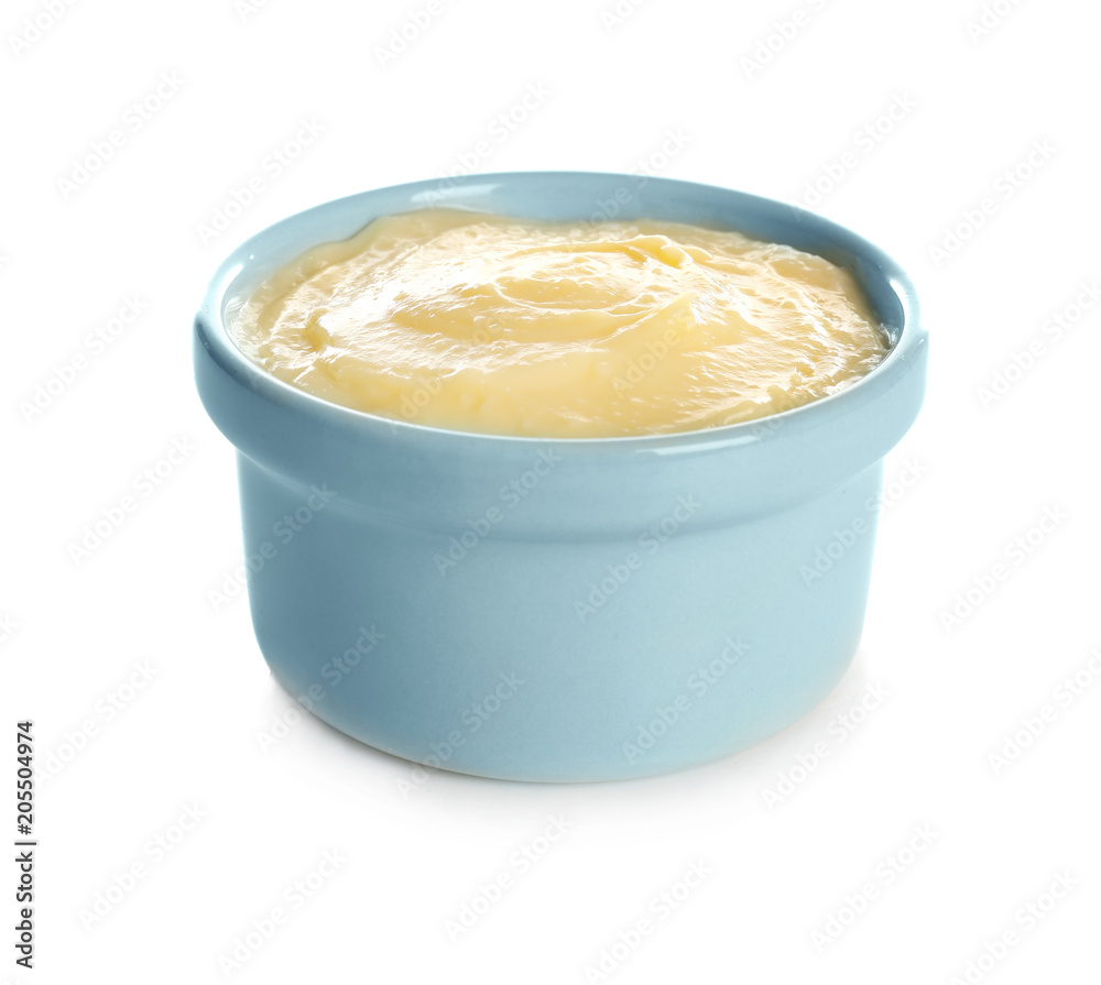 Tasty vanilla pudding in ramekin on white background Tasty vanilla pudding in ramekin on white background