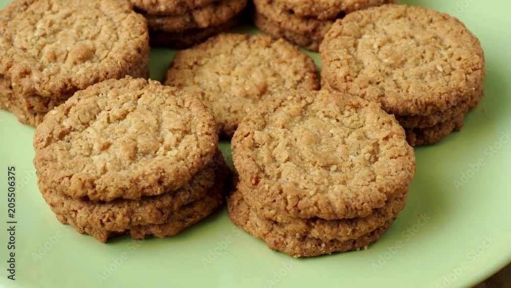Tasty cookies biscuits. Stack of sugar cookies biscuits in green plate. Tasty cookies biscuits. Stack of sugar cookies biscuits in green plate.