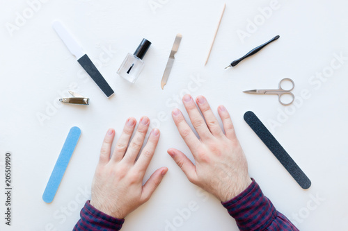 nail care and manicure. hands on a white background