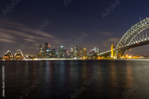 opera house and harbour bridge in Sydney at night, It is illuminated by golden lights . Australia : 31/03/18
