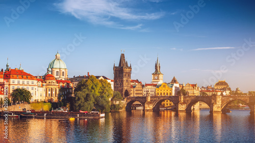Scenic spring sunset aerial view of the Old Town pier architecture and Charles Bridge over Vltava river in Prague, Czech Republic © daliu