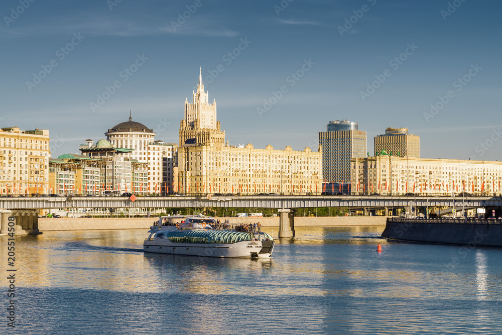 Sunny view of Smolenskaya embankment and Moskva river, Moscow, Russia.