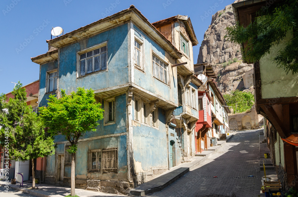 Beautiful old street in downtown with houses with wooden shutters in the classic Turkish Ottoman style, Turkey, center of Afyonkarahisar The two-storyed buildings Beautiful old street in downtown with houses with wooden shutters in the classic Turkish Ottoman style, Turkey, center of Afyonkarahisar The two-storyed buildings
