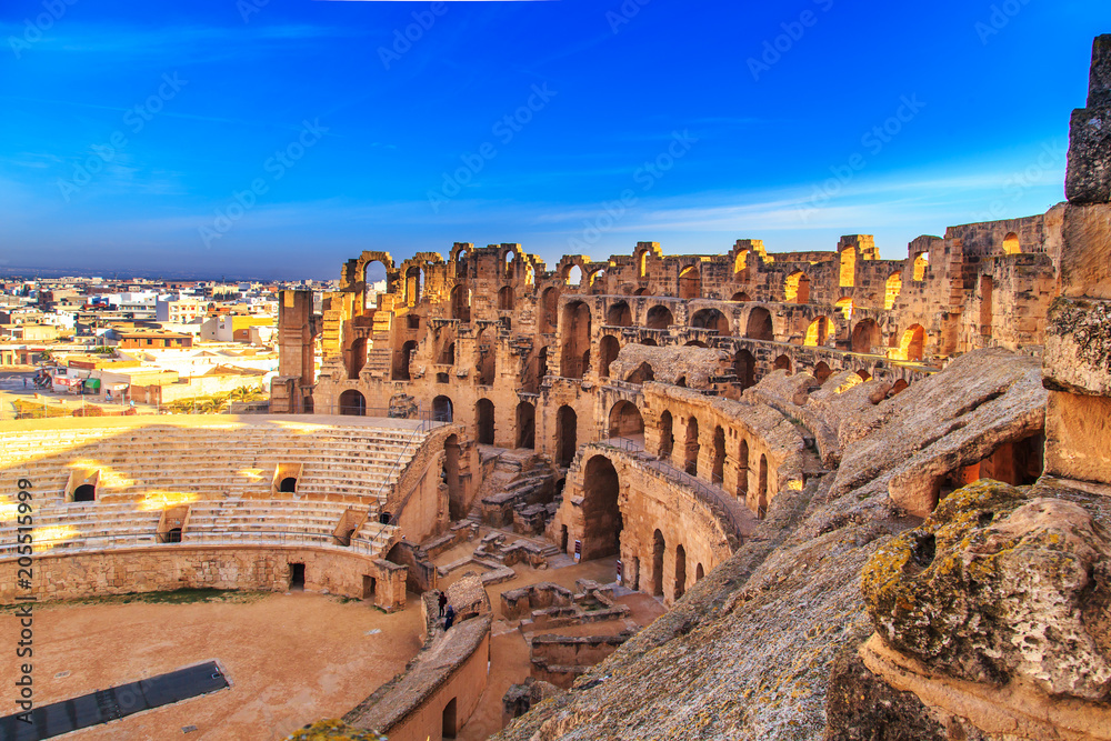 The ruins of the amphitheater in El Jeme, Tunisia. - obrazy, fototapety, plakaty 