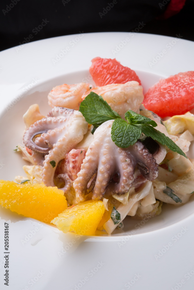 Seafood salad served with grapefruit Seafood salad served with grapefruit
